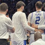 Cooper Flagg is helped off the floor after suffering an ankle injury against Georgia Tech in the ACC Tournament.