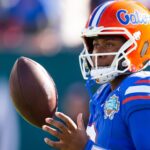 DJ Lagway tosses a ball in the air before a Florida game.