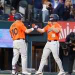 Auburn baseball players celebrate.