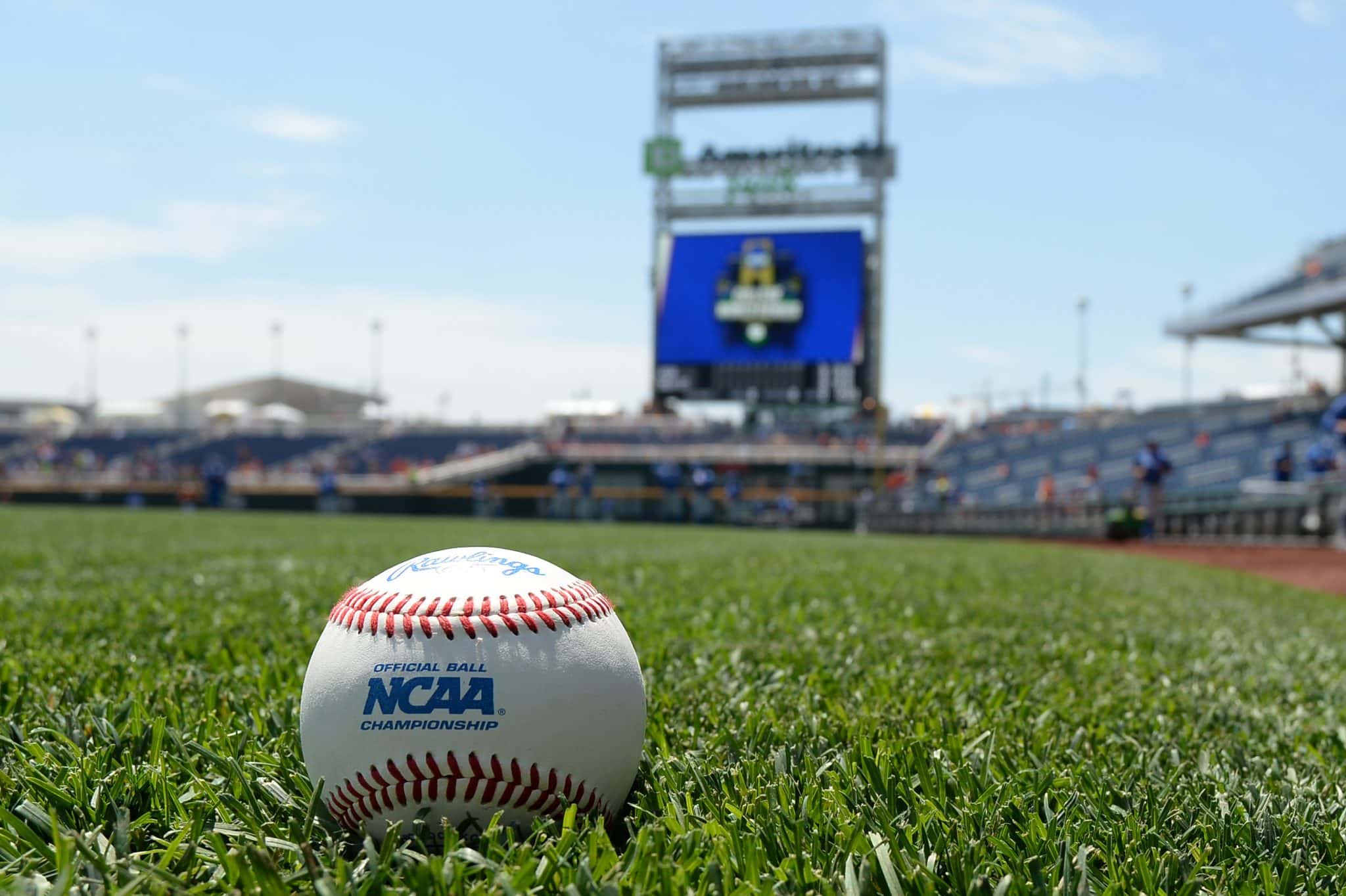 A baseball is shown in the grass at TD Ameritrade Park in Omaha.